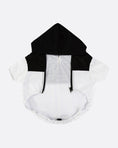 Load image into Gallery viewer, Black and white hooded garment on a white background

