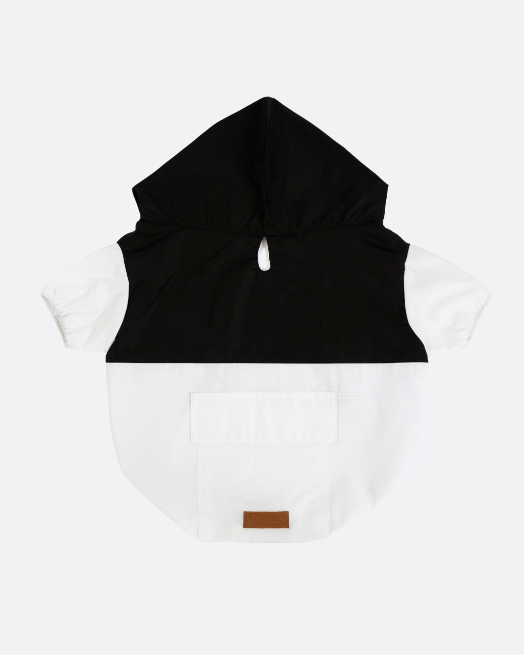 Black and white sleeveless jacket with a brown label on a white background