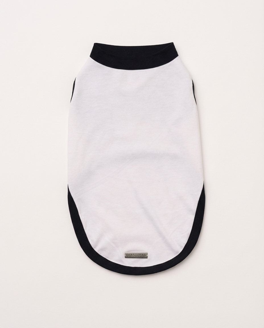 White dog sweater with black trim on a white background