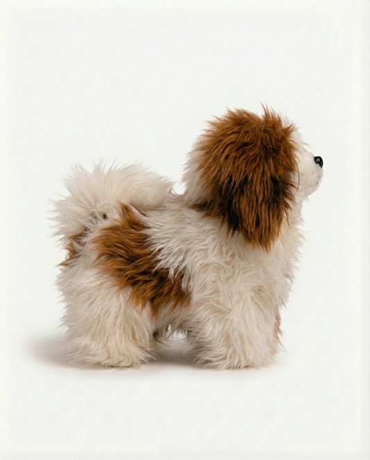 Stuffed dog toy with brown and white fur on a white background