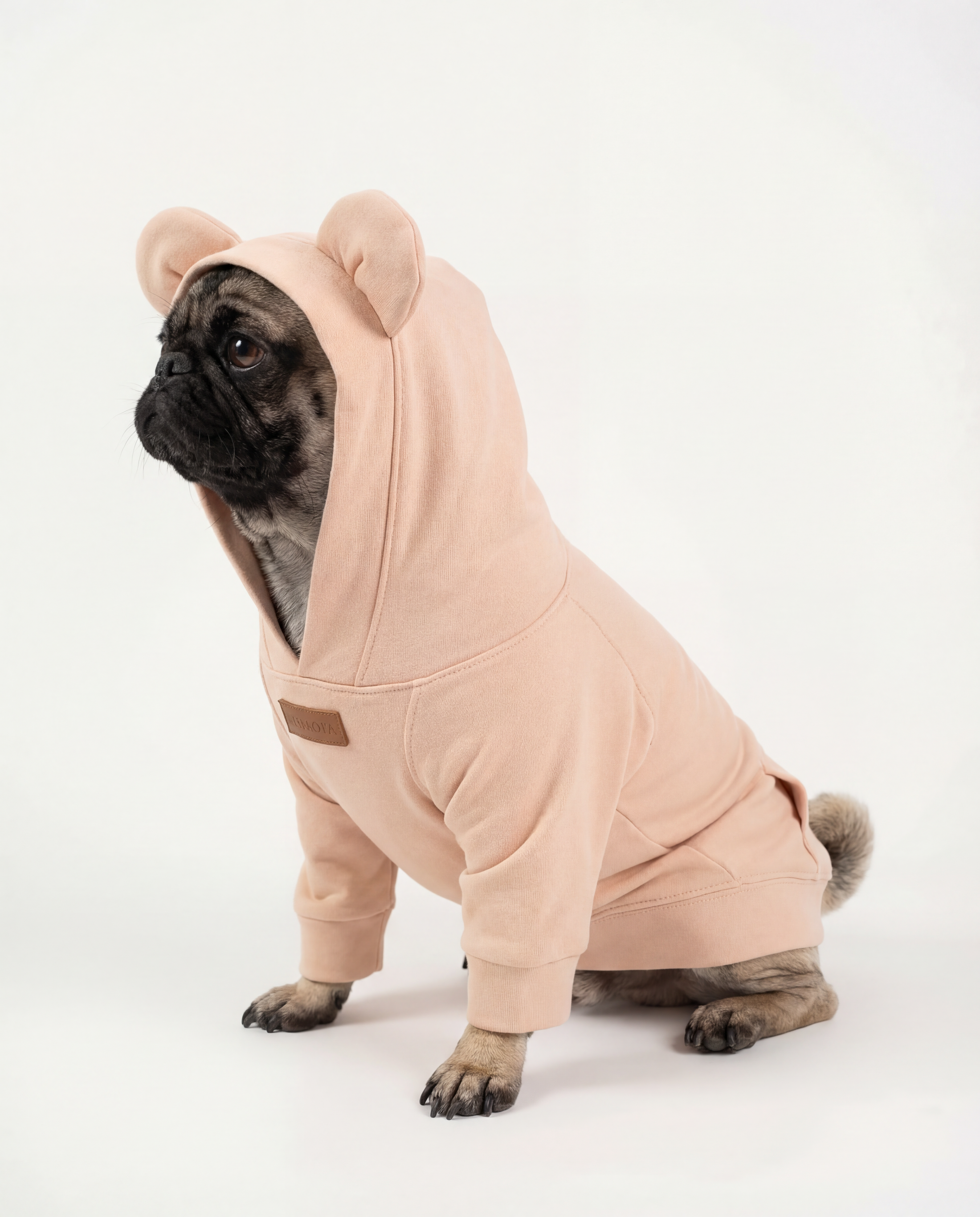 Dog wearing a pink onesie with bear ears - Snuggle Snitch Hoodie - Best stylish dog hoodies